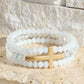 Layered Glass Bead Bracelet with Cross